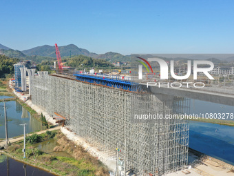 Workers are working at the construction site of the Xuancheng-Hangzhou Railway interchange in Huzhou, China, on November 22, 2023. (