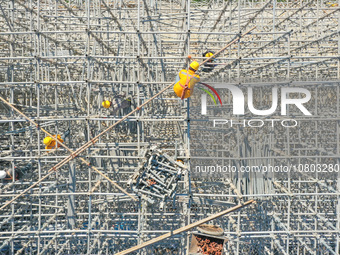 Workers are working at the construction site of the Xuancheng-Hangzhou Railway interchange in Huzhou, China, on November 22, 2023. (