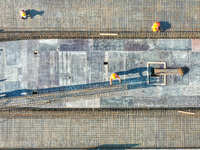 Workers are working at the construction site of the Xuancheng-Hangzhou Railway interchange in Huzhou, China, on November 22, 2023. (