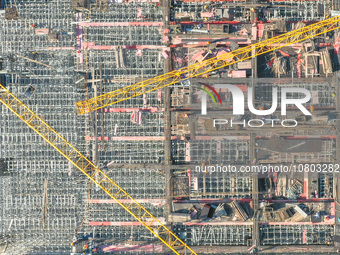 Workers are working at the construction site of the Xuancheng-Hangzhou Railway interchange in Huzhou, China, on November 22, 2023. (