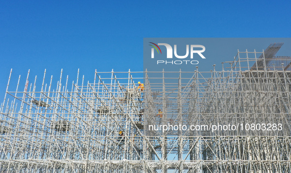 Workers are working at the construction site of the Xuancheng-Hangzhou Railway interchange in Huzhou, China, on November 22, 2023. 