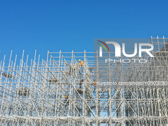 Workers are working at the construction site of the Xuancheng-Hangzhou Railway interchange in Huzhou, China, on November 22, 2023. (