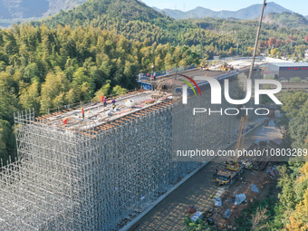 Workers are working at the construction site of the Xuancheng-Hangzhou Railway interchange in Huzhou, China, on November 22, 2023. (