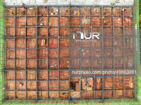 Workers are working at the construction site of a comprehensive utilization base for automobile recycling in Lianyungang, East China's Jiang...