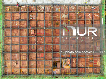 Workers are working at the construction site of a comprehensive utilization base for automobile recycling in Lianyungang, East China's Jiang...