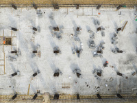 Workers are working at the construction site of a comprehensive utilization base for automobile recycling in Lianyungang, East China's Jiang...