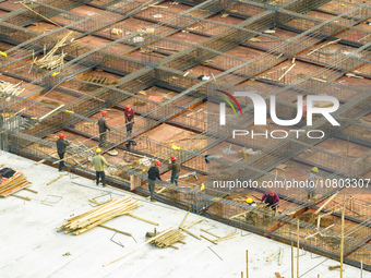 Workers are working at the construction site of a comprehensive utilization base for automobile recycling in Lianyungang, East China's Jiang...