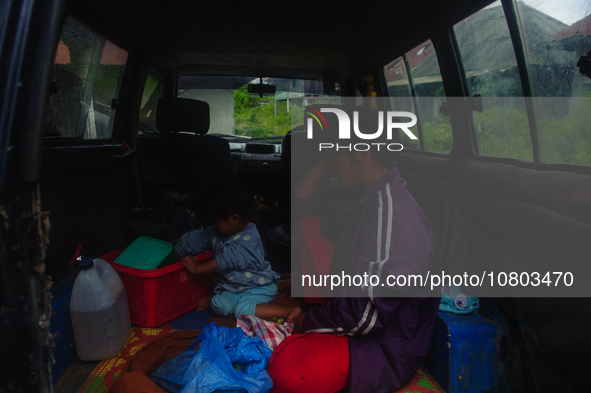 Nurhalimah Br Sembiring Milala, a 33-year-old member of the indigenous Karo people, is seen with her 2-year-old child, Gloria Br Ginting, in...