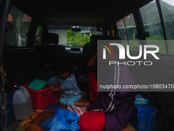 Nurhalimah Br Sembiring Milala, a 33-year-old member of the indigenous Karo people, is seen with her 2-year-old child, Gloria Br Ginting, in...