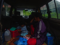 Nurhalimah Br Sembiring Milala, a 33-year-old member of the indigenous Karo people, is seen with her 2-year-old child, Gloria Br Ginting, in...