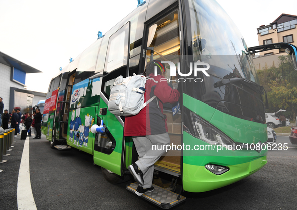 Students are getting on a mobile vaccination van to receive their flu shots in Guiyang, Guizhou province, China, on November 24, 2023. 