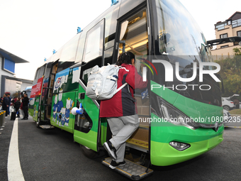 Students are getting on a mobile vaccination van to receive their flu shots in Guiyang, Guizhou province, China, on November 24, 2023. (