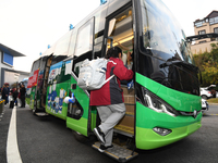 Students are getting on a mobile vaccination van to receive their flu shots in Guiyang, Guizhou province, China, on November 24, 2023. (