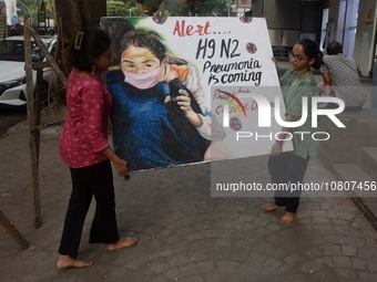 Students are painting posters as part of an awareness campaign for the ongoing H9N2 Virus in Mumbai, India, on November 25, 2025. (