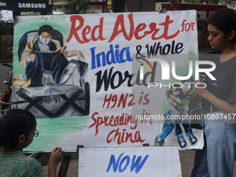 Students are painting posters as part of an awareness campaign for the ongoing H9N2 Virus in Mumbai, India, on November 25, 2025. (