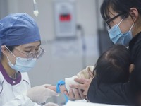 A nurse is preparing an infusion for a child in the infusion area of Hangzhou First People's Hospital in Hangzhou, Zhejiang province, China,...