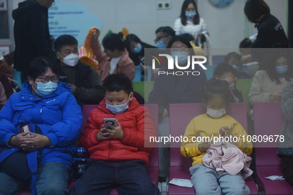 A nurse is preparing an infusion for a child in the infusion area of Hangzhou First People's Hospital in Hangzhou, Zhejiang province, China,...