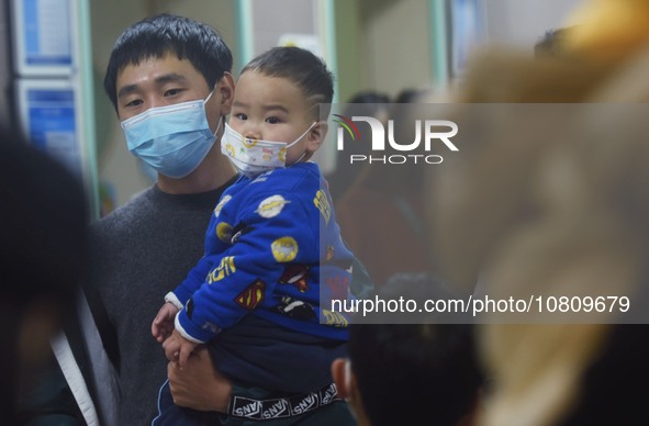 A nurse is preparing an infusion for a child in the infusion area of Hangzhou First People's Hospital in Hangzhou, Zhejiang province, China,...