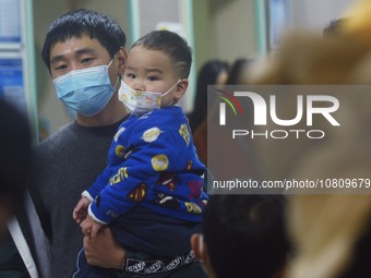 A nurse is preparing an infusion for a child in the infusion area of Hangzhou First People's Hospital in Hangzhou, Zhejiang province, China,...