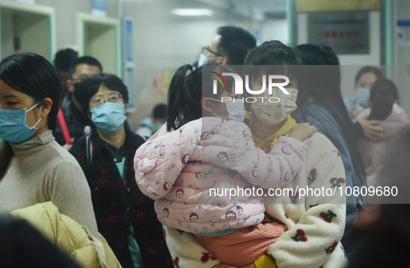 A nurse is preparing an infusion for a child in the infusion area of Hangzhou First People's Hospital in Hangzhou, Zhejiang province, China,...