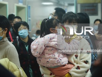 A nurse is preparing an infusion for a child in the infusion area of Hangzhou First People's Hospital in Hangzhou, Zhejiang province, China,...