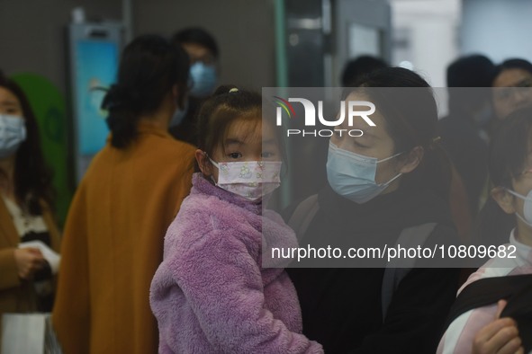 A nurse is preparing an infusion for a child in the infusion area of Hangzhou First People's Hospital in Hangzhou, Zhejiang province, China,...