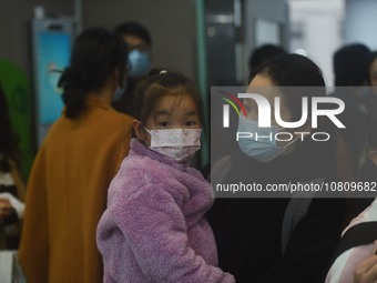 A nurse is preparing an infusion for a child in the infusion area of Hangzhou First People's Hospital in Hangzhou, Zhejiang province, China,...