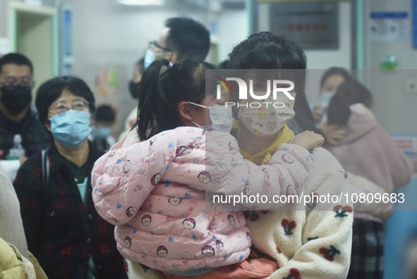 A nurse is preparing an infusion for a child in the infusion area of Hangzhou First People's Hospital in Hangzhou, Zhejiang province, China,...