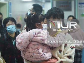 A nurse is preparing an infusion for a child in the infusion area of Hangzhou First People's Hospital in Hangzhou, Zhejiang province, China,...