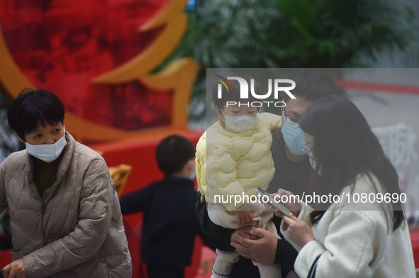 A nurse is preparing an infusion for a child in the infusion area of Hangzhou First People's Hospital in Hangzhou, Zhejiang province, China,...