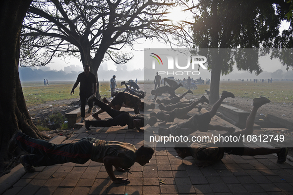 Indian army soldiers are exercising on the ground on a smoggy morning amid rising air pollution levels in Kolkata, India, on November 27, 20...