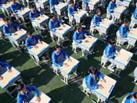 Students are performing desk exercises at the Third Nationalities Middle School in Congjiang County, Guizhou Province, southwest China, on N...