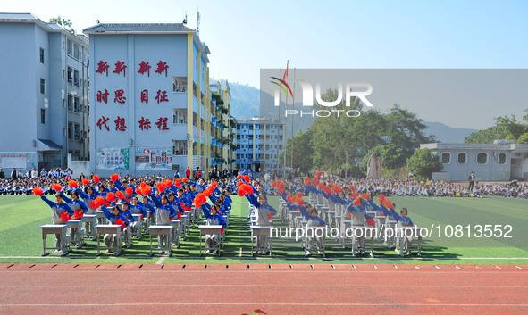 Students are performing desk exercises at the Third Nationalities Middle School in Congjiang County, Guizhou Province, southwest China, on N...