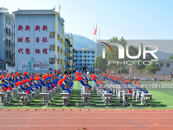 Students are performing desk exercises at the Third Nationalities Middle School in Congjiang County, Guizhou Province, southwest China, on N...