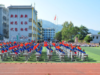 Students are performing desk exercises at the Third Nationalities Middle School in Congjiang County, Guizhou Province, southwest China, on N...