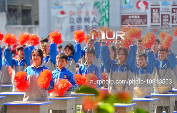 Students are performing desk exercises at the Third Nationalities Middle School in Congjiang County, Guizhou Province, southwest China, on N...