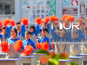 Students are performing desk exercises at the Third Nationalities Middle School in Congjiang County, Guizhou Province, southwest China, on N...