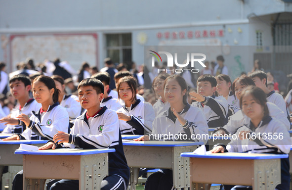 Students are performing desk exercises at the Third Nationalities Middle School in Congjiang County, Guizhou Province, southwest China, on N...