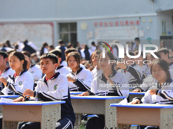 Students are performing desk exercises at the Third Nationalities Middle School in Congjiang County, Guizhou Province, southwest China, on N...