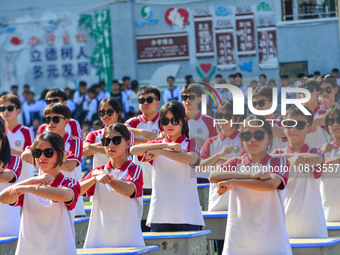 Students are performing desk exercises at the Third Nationalities Middle School in Congjiang County, Guizhou Province, southwest China, on N...