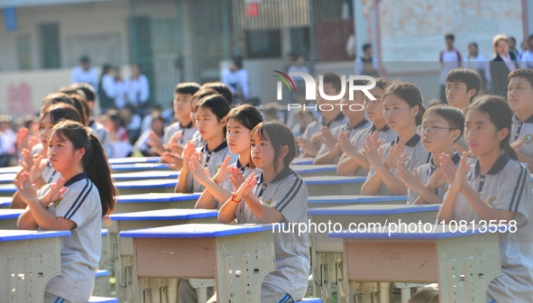 Students are performing desk exercises at the Third Nationalities Middle School in Congjiang County, Guizhou Province, southwest China, on N...