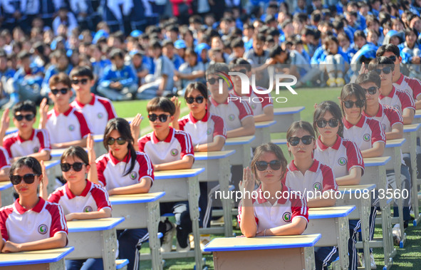 Students are performing desk exercises at the Third Nationalities Middle School in Congjiang County, Guizhou Province, southwest China, on N...