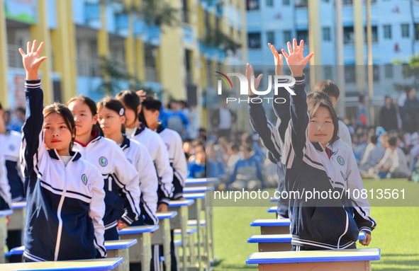 Students are performing desk exercises at the Third Nationalities Middle School in Congjiang County, Guizhou Province, southwest China, on N...