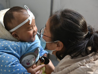 A 7-month-old baby is receiving infusion treatment at the Department of Pediatrics of the People's Hospital in Fuyang, Anhui province, China...