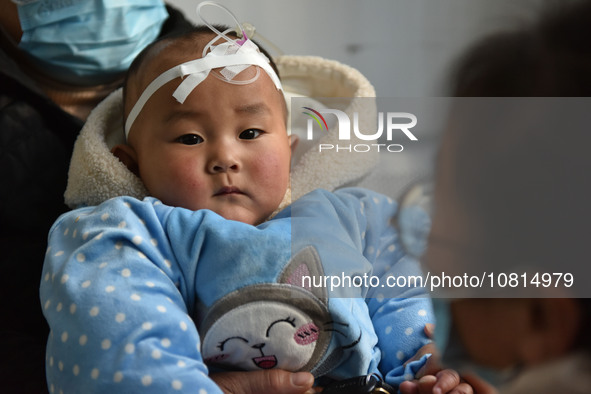 A 7-month-old baby is receiving infusion treatment at the Department of Pediatrics of the People's Hospital in Fuyang, Anhui province, China...