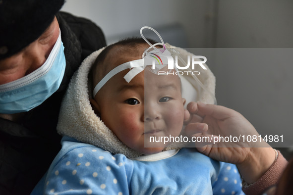 A 7-month-old baby is receiving infusion treatment at the Department of Pediatrics of the People's Hospital in Fuyang, Anhui province, China...