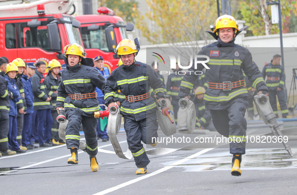 Firefighters are conducting a fire drill at the Qianyuan fire prevention and rescue station in Deqing County, Huzhou City, Zhejiang Province...