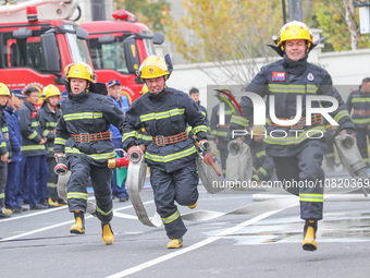 Firefighters are conducting a fire drill at the Qianyuan fire prevention and rescue station in Deqing County, Huzhou City, Zhejiang Province...