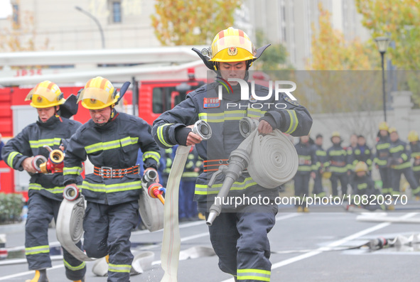 Firefighters are conducting a fire drill at the Qianyuan fire prevention and rescue station in Deqing County, Huzhou City, Zhejiang Province...