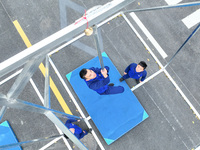 Firefighters are conducting a fire drill at the Qianyuan fire prevention and rescue station in Deqing County, Huzhou City, Zhejiang Province...